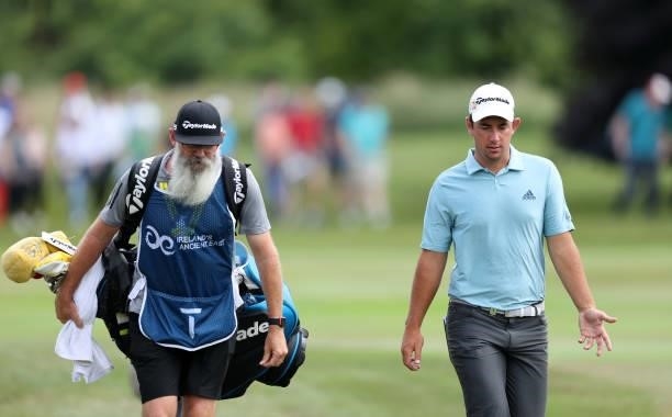 Lucas Herbert of Australia chats with his caddie Nick Pugh on the 9th hole during Day Three of The Dubai Duty Free Irish Open at Mount Juliet Golf...