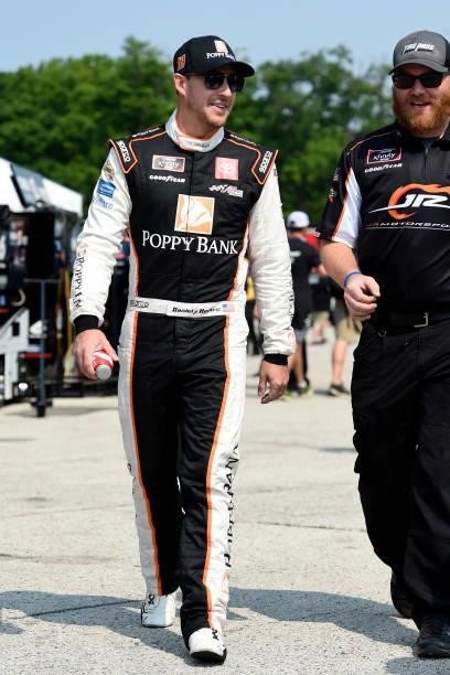 Daniel Hemric, driver of the Poppy Bank Toyota, walks the grid during the NASCAR Xfinity Series Henry 180 at Road America on July 03, 2021 in Elkhart...