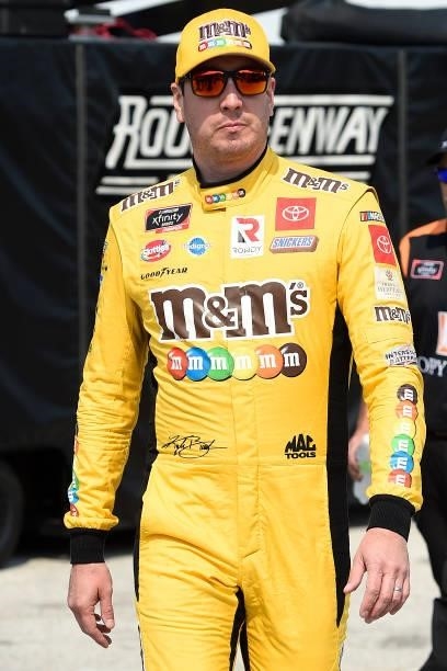 Kyle Busch, driver of the M&M's Ice Cream Toyota, walks the grid during the NASCAR Xfinity Series Henry 180 at Road America on July 03, 2021 in...