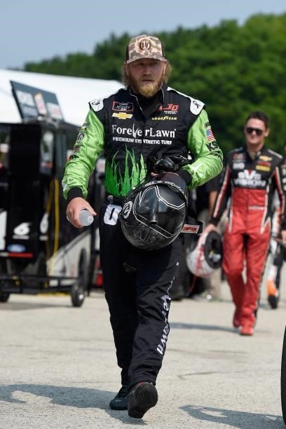 Jeffrey Earnhardt, driver of the ForeverLawn Chevrolet, walks the grid during the NASCAR Xfinity Series Henry 180 at Road America on July 03, 2021 in...