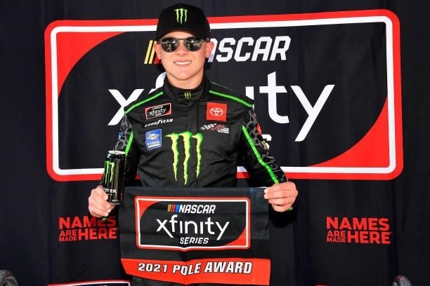Ty Gibbs, driver of the Monster Energy Toyota, poses for photos after winning the pole award during the NASCAR Xfinity Series Henry 180 at Road...