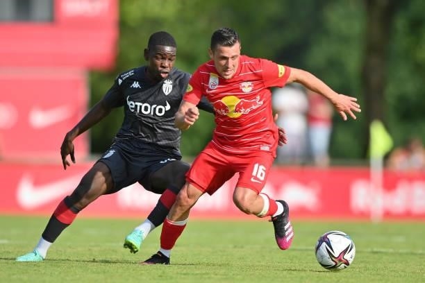 Zlatko Junuzovic of FC Red Bull Salzburg and Eliot Matazo of AS Monaco compete for the ball during the Pre-Season Friendly match between FC Red Bull...