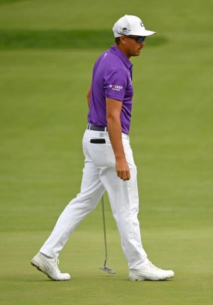 Rickie Fowler lines up a putt on the second green during the third round of the Rocket Mortgage Classic on July 03, 2021 at the Detroit Golf Club in...