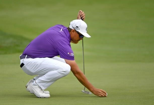Rickie Fowler lines up a putt on the second green during the third round of the Rocket Mortgage Classic on July 03, 2021 at the Detroit Golf Club in...