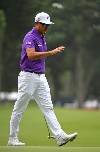 Rickie Fowler reacts to his putt on the first hole during the third round of the Rocket Mortgage Classic on July 03, 2021 at the Detroit Golf Club in...