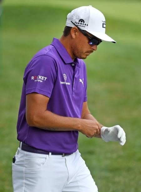 Rickie Fowler plays his shot from the first tee during the third round of the Rocket Mortgage Classic on July 03, 2021 at the Detroit Golf Club in...