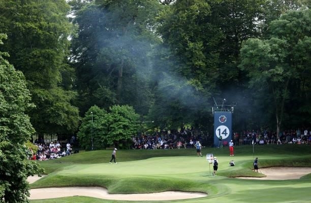 General view of the 14th green area as smoke fills the air during Day Three of The Dubai Duty Free Irish Open at Mount Juliet Golf Club on July 03,...