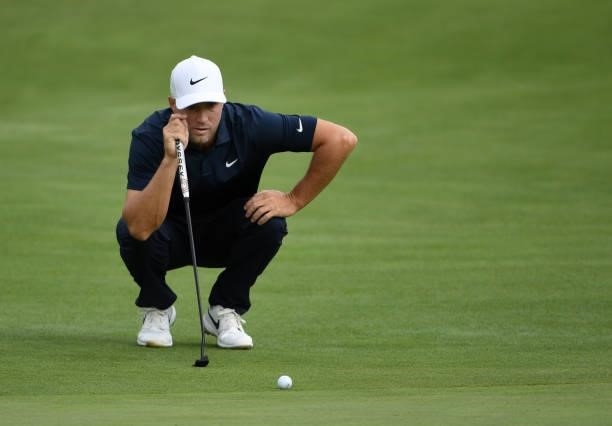 Alex Noren of Sweden lines up a putt on the second green during the third round of the Rocket Mortgage Classic on July 03, 2021 at the Detroit Golf...
