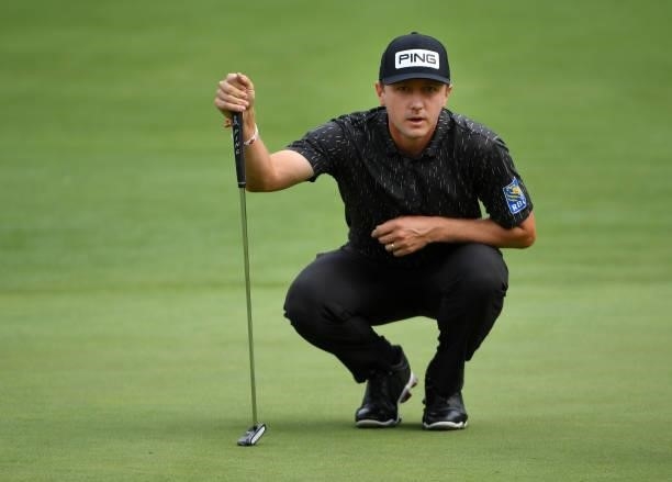 Mackenzie Hughes of Canada lines up a putt on the second green during the third round of the Rocket Mortgage Classic on July 03, 2021 at the Detroit...