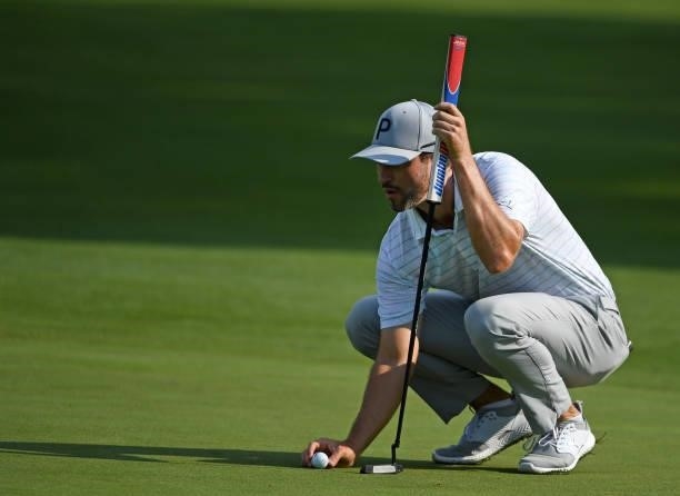 Chris Baker lines up a putt on the second green during the third round of the Rocket Mortgage Classic on July 03, 2021 at the Detroit Golf Club in...