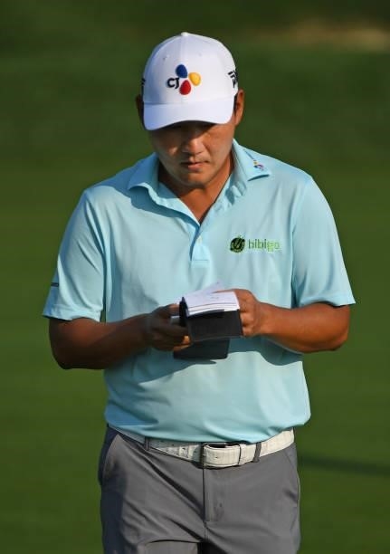 Sung Kang of South Korea plays his shot on the fourth hole during the third round of the Rocket Mortgage Classic on July 03, 2021 at the Detroit Golf...
