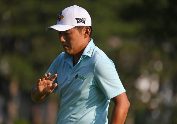 Sung Kang of South Korea reacts to his putt on the third green during the third round of the Rocket Mortgage Classic on July 03, 2021 at the Detroit...