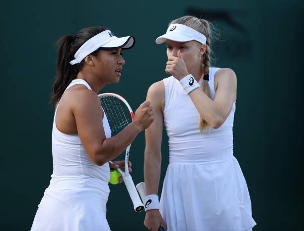 Harriet Dart and Heather Watson of Great Britain interact during their ladies' doubles second round match against Petra Martic of Croatia and Shelby...
