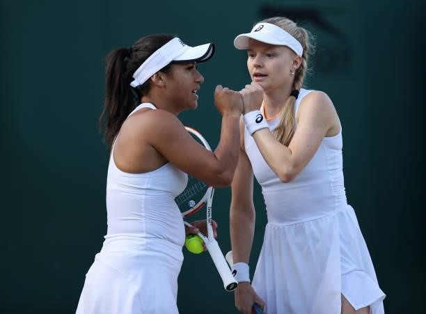 Harriet Dart and Heather Watson of Great Britain interact during their ladies' doubles second round match against Petra Martic of Croatia and Shelby...