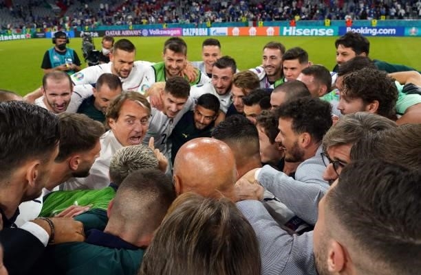Head coach Italy Roberto Mancini celebrates with players and his staff after the UEFA Euro 2020 Championship Quarter-final match between Belgium and...