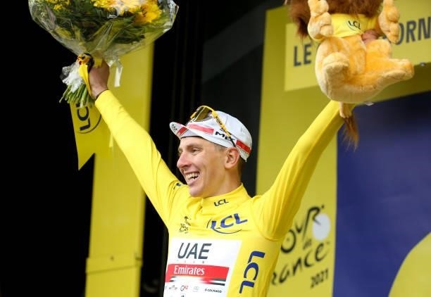 Tadej Pogacar of Slovenia and UAE Team Emirates wears the yellow jersey of race's leader during the trophy ceremony of stage 8 of the 108th Tour de...