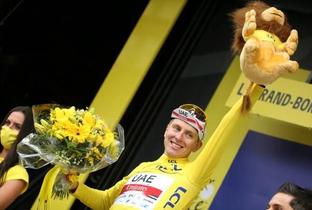 Tadej Pogacar of Slovenia and UAE Team Emirates wears the yellow jersey of race's leader during the trophy ceremony of stage 8 of the 108th Tour de...