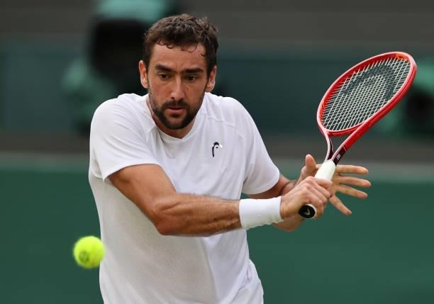 Marin Cilic of Croatia plays a backhand during his men's singles third round match against Daniil Medvedev of Russia during Day Six of The...