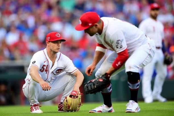 Sonny Gray of the Cincinnati Reds kneels after an attempt to field the ball during a game between the Chicago Cubs and Cincinnati Reds at Great...