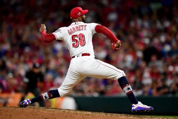 Amir Garrett of the Cincinnati Reds pitches during a game between the Chicago Cubs and Cincinnati Reds at Great American Ball Park on July 02, 2021...