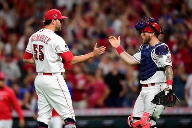 Heath Hembree and Tucker Barnhart of the Cincinnati Reds celebrate their 2-1 win during a game between the Chicago Cubs and Cincinnati Reds at Great...