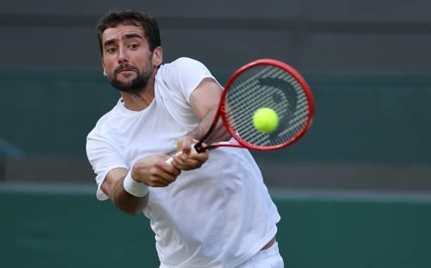 Marin Cilic of Croatia plays a backhand during his men's singles third round match against Daniil Medvedev of Russia during Day Six of The...