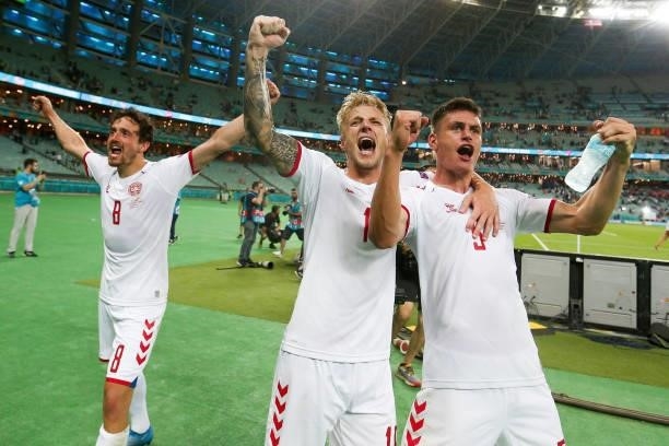 Daniel Wass and Joakim Maehle of Denmark celebrate their side's victory after the UEFA Euro 2020 Championship Quarter-final match between Czech...