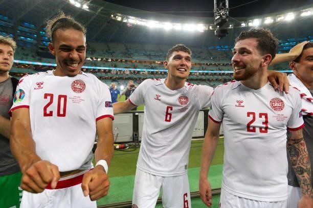 Yussuf Poulsen, Jens Stryger Larsen and Pierre-Emile Højbjerg of Denmark celebrate their side's victory after the UEFA Euro 2020 Championship...