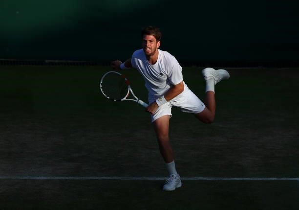 Cameron Norrie of Great Britain plays a forehand alongside partner Jaume Munar of Spain during their men's doubles second round match against Filip...