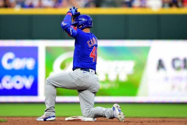 Willson Contreras of the Chicago Cubs celebrates after sliding into second base during a game between the Chicago Cubs and Cincinnati Reds at Great...
