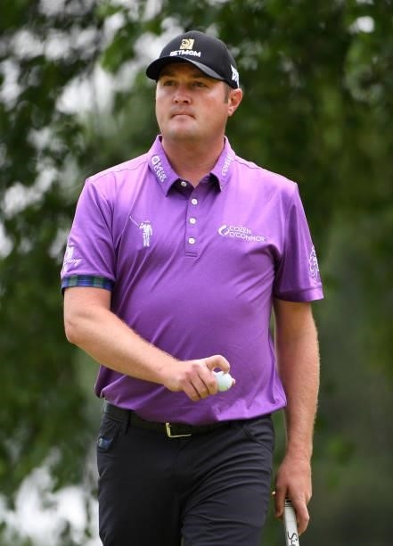 Jason Kokrak reacts to his putt on the third green during the third round of the Rocket Mortgage Classic on July 03, 2021 at the Detroit Golf Club in...