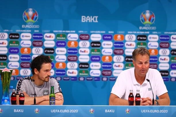 In this handout picture provided by UEFA, Thomas Delaney of Denmark and Kasper Hjulmand, Head Coach of Denmark speak to the media during the Denmark...