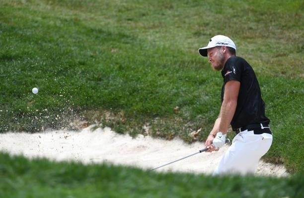 Danny Willett of England plays a shot from a bunker on the fifth hole during the third round of the Rocket Mortgage Classic on July 03, 2021 at the...