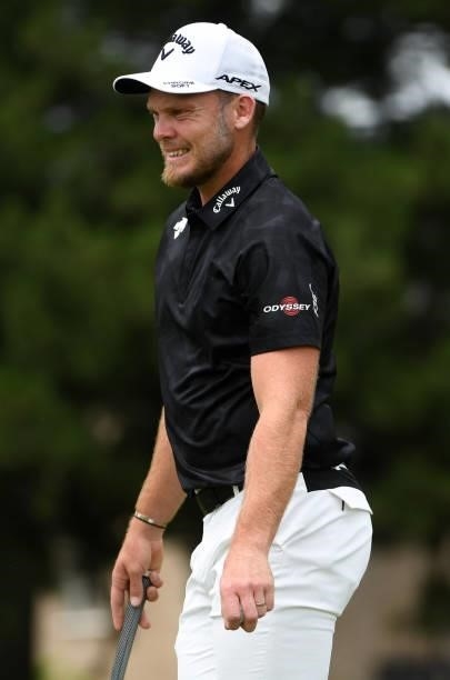Danny Willett of England reacts to his putt on the sixth hole during the third round of the Rocket Mortgage Classic on July 03, 2021 at the Detroit...