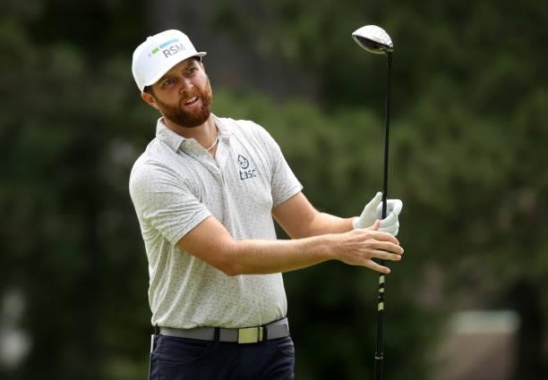 Chris Kirk plays his shot from the fourth tee during the third round of the Rocket Mortgage Classic on July 03, 2021 at the Detroit Golf Club in...