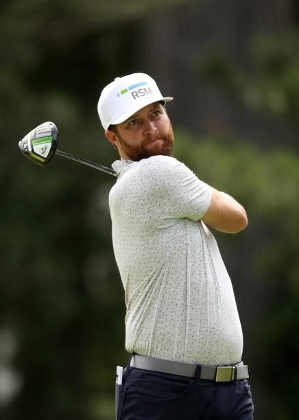 Chris Kirk plays his shot from the fourth tee during the third round of the Rocket Mortgage Classic on July 03, 2021 at the Detroit Golf Club in...