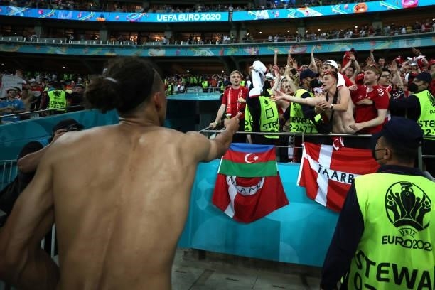 Yussuf Poulsen of Denmark throws his shirt towards the fans after the UEFA Euro 2020 Championship Quarter-final match between Czech Republic and...