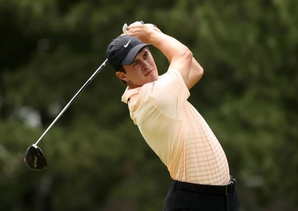 Davis Thompson plays his shot from the fourth tee during the third round of the Rocket Mortgage Classic on July 03, 2021 at the Detroit Golf Club in...