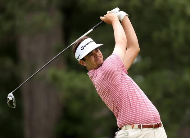 Beau Hossler plays his shot from the fourth tee during the third round of the Rocket Mortgage Classic on July 03, 2021 at the Detroit Golf Club in...