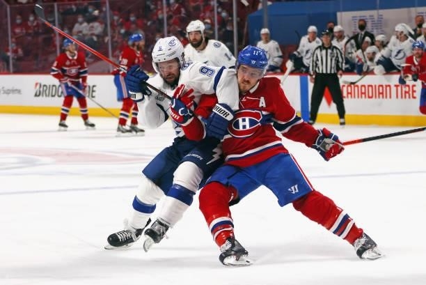 Tyler Johnson of the Tampa Bay Lightning battles with Brendan Gallagher of the Montreal Canadiens during Game Three of the 2021 NHL Stanley Cup Final...
