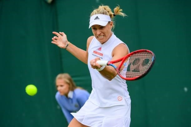 Angelique Kerber of Germany hits a forehand against Aliaksandra Sasnovich of Belarus in the third round of the ladies singles during Day Six of The...