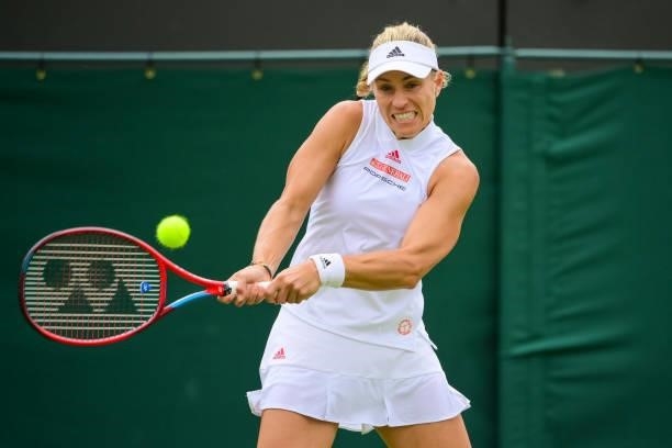 Angelique Kerber of Germany hits a backhand against Aliaksandra Sasnovich of Belarus in the third round of the ladies singles during Day Six of The...