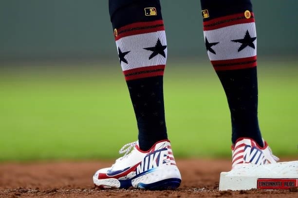Detailed view of the patriotic cleats and socks of Joey Votto of the Cincinnati Reds during a game between the Chicago Cubs and Cincinnati Reds at...