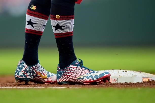 Detailed view of the patriotic cleats and socks of Jesse Winker of the Cincinnati Reds during a game between the Chicago Cubs and Cincinnati Reds at...