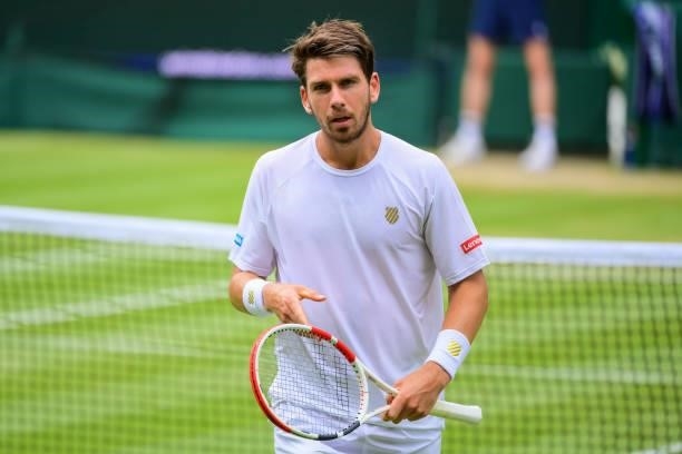 Cameron Norrie of Great Britain looks to his team during his match against Roger Federer of Switzerland in the third round of the gentlemen's singles...