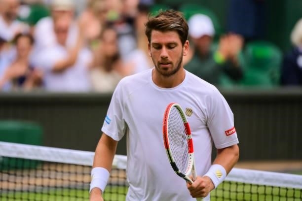 Cameron Norrie of Great Britain looks disappointed after losing a point against Roger Federer of Switzerland in the third round of the gentlemen's...
