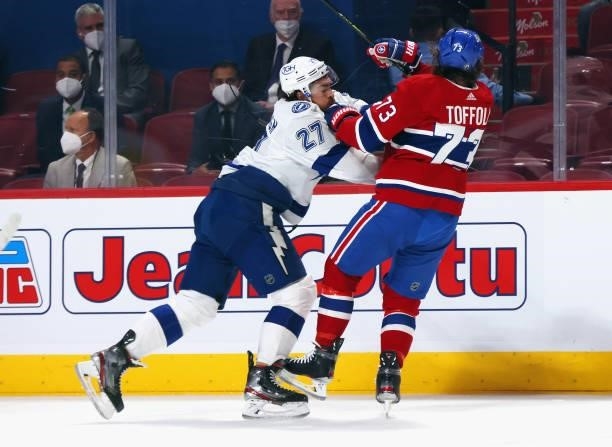 Ryan McDonagh of the Tampa Bay Lightning checks Tyler Toffoli of the Montreal Canadiens during Game Three of the 2021 NHL Stanley Cup Final at the...