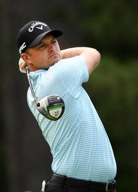 Tom Lewis of England plays his shot from the fourth tee during the third round of the Rocket Mortgage Classic on July 03, 2021 at the Detroit Golf...