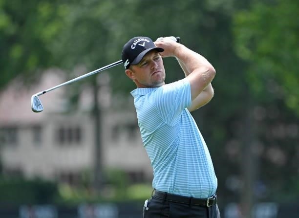 Tom Lewis of England plays his shot on the fourth hole during the third round of the Rocket Mortgage Classic on July 03, 2021 at the Detroit Golf...