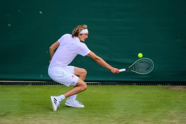 Alexander Zverev of Germany hits a backhand against Taylor Fritz of the United States in the third round of the gentlemen's singles during Day Six of...